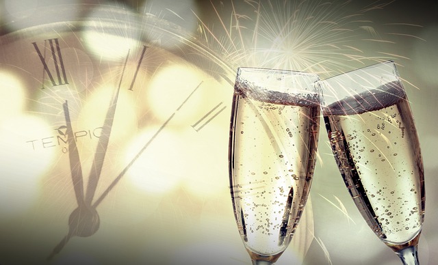 two glasses of champagne with clock